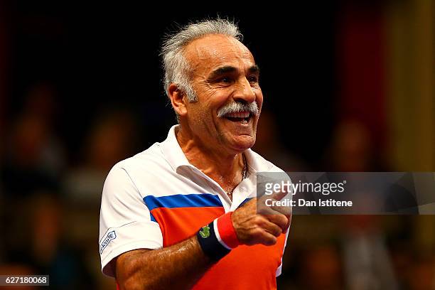 Mansour Bahrami of Iran and John McEnroe of the United States during their doubles match against Henri Leconte of France and Jamie Murray of Great...