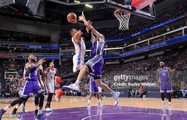 Russell Westbrook of the Oklahoma City Thunder goes up for the shot against Kosta Koufos of the Sacramento Kings on November 23, 2016 at Golden 1...