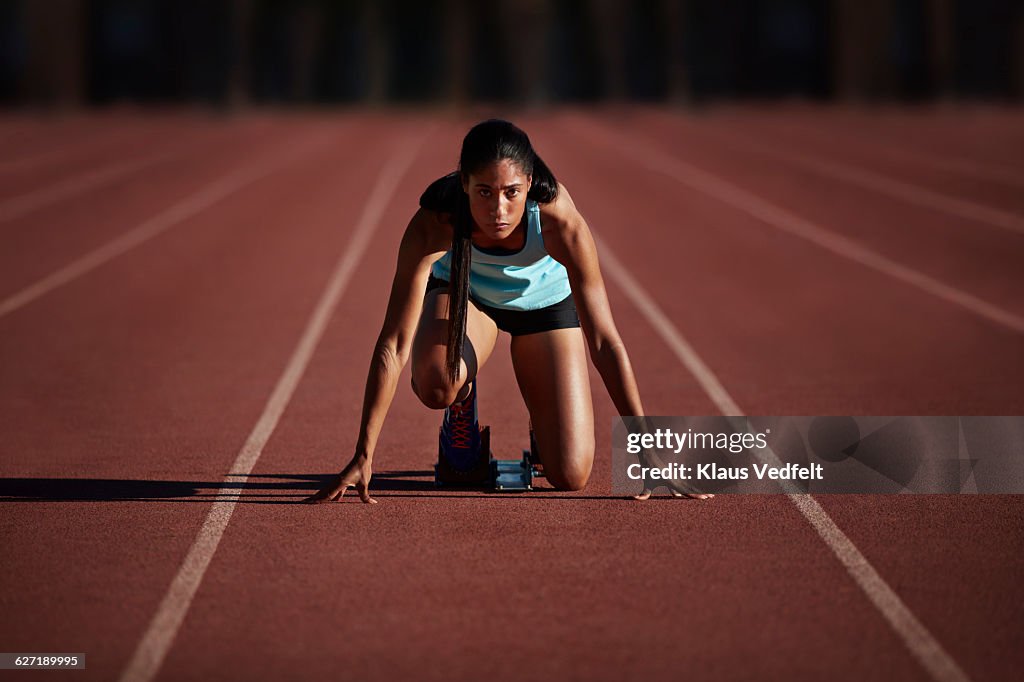 Portrait of female runner getting ready