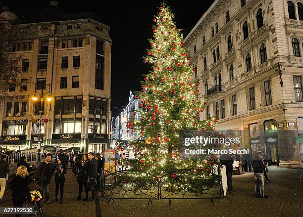 Shoppers walk near a Christmas teee in one of the main squares in the City Centre on December 2, 2016 in Budapest, Hungary. The traditional Christmas...