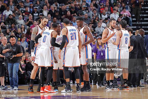 Steven Adams, Russell Westbrook, Victor Oladipo, Andre Roberson and Jerami Grant of the Oklahoma City Thunder huddle up during the game against the...