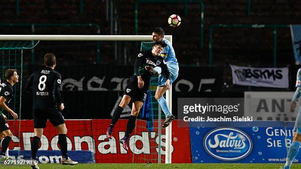 Lennart Stoll of Muenster challenges Kevin Conrad of Chemnitz during the Third League match between Preussen Muenster and Chemnitzer FC at...