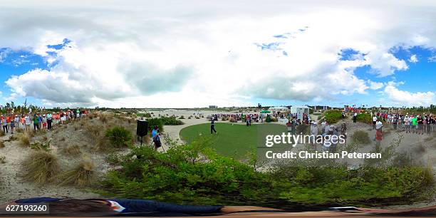 Tiger Woods hits a tee shot on the first hole as a gallery of fans watch during round two of the Hero World Challenge at Albany, The Bahamas on...