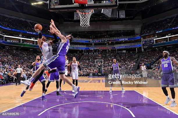 Russell Westbrook of the Oklahoma City Thunder shoots against Kosta Koufos of the Sacramento Kings on November 23, 2016 at Golden 1 Center in...