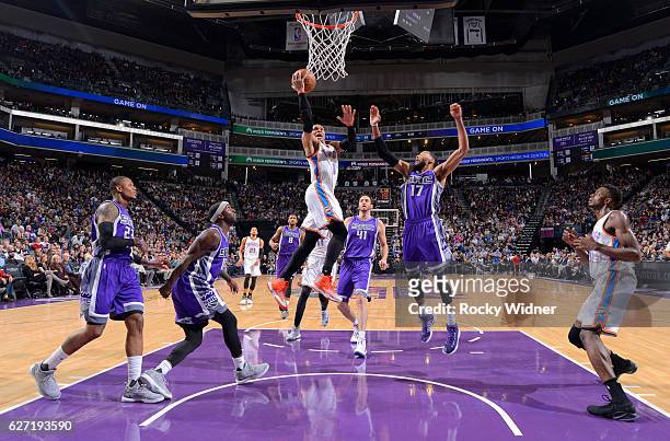Russell Westbrook of the Oklahoma City Thunder shoots a layup against Garrett Temple of the Sacramento Kings on November 23, 2016 at Golden 1 Center...