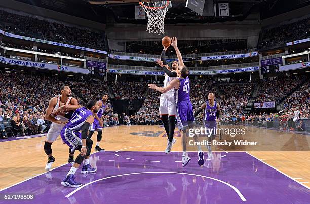 Enes Kanter of the Oklahoma City Thunder shoots against Kosta Koufos of the Sacramento Kings on November 23, 2016 at Golden 1 Center in Sacramento,...