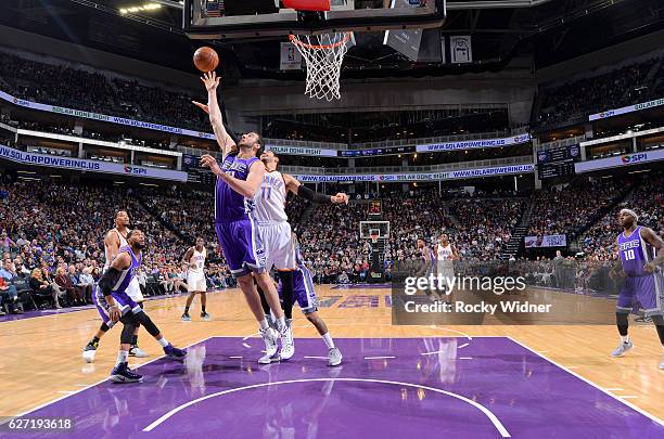 Kosta Koufos of the Sacramento Kings rebounds against Enes Kanter of the Oklahoma City Thunder on November 23, 2016 at Golden 1 Center in Sacramento,...