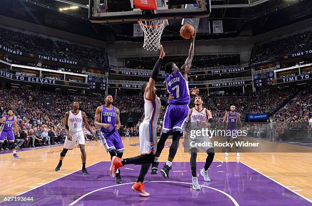 Darren Collison of the Sacramento Kings shoots a layup against Russell Westbrook of the Oklahoma City Thunder on November 23, 2016 at Golden 1 Center...