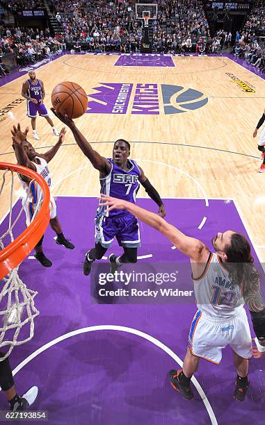 Darren Collison of the Sacramento Kings shoots a layup against Steven Adams of the Oklahoma City Thunder on November 23, 2016 at Golden 1 Center in...