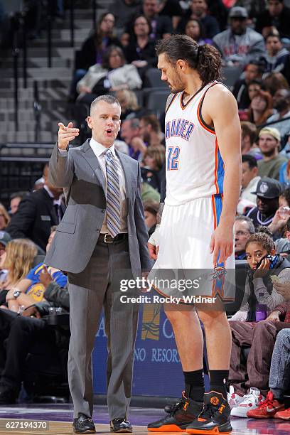 Head Coach Billy Donovan of the Oklahoma City Thunder coaches Steven Adams against the Sacramento Kings on November 23, 2016 at Golden 1 Center in...