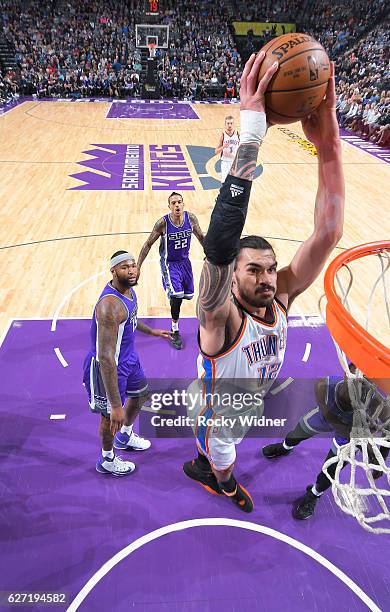 Steven Adams of the Oklahoma City Thunder dunks against the Sacramento Kings on November 23, 2016 at Golden 1 Center in Sacramento, California. NOTE...