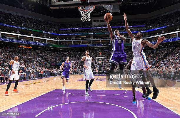 Ty Lawson of the Sacramento Kings shoots a layup against Jerami Grant of the Oklahoma City Thunder on November 23, 2016 at Golden 1 Center in...