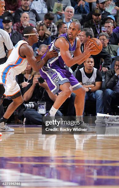 Arron Afflalo of the Sacramento Kings handles the ball against Semaj Christon of the Oklahoma City Thunder on November 23, 2016 at Golden 1 Center in...