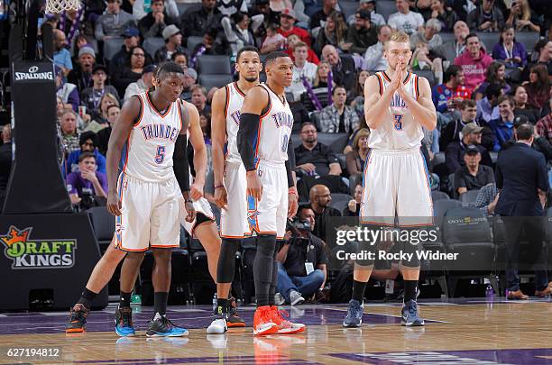 Victor Oladipo, Andre Roberson, Russell Westbrook and Domantas Sabonis of the Oklahoma City Thunder look on during the game against the Sacramento...