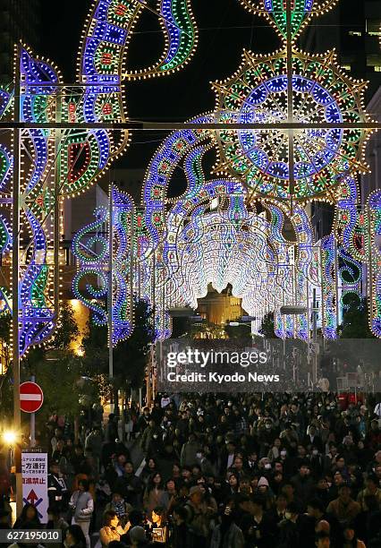 Spectators visit the Kobe Luminarie light festival, held to commemorate victims of the 1995 Great Hanshin Earthquake in the western Japan port city...