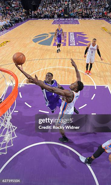 Darren Collison of the Sacramento Kings shoots a layup against Jerami Grant of the Oklahoma City Thunder on November 23, 2016 at Golden 1 Center in...