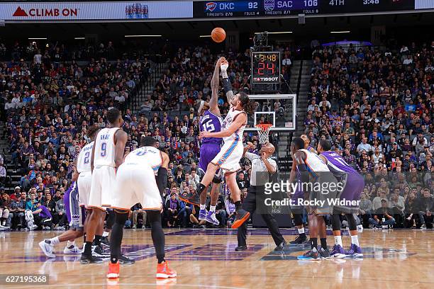 Steven Adams of the Oklahoma City Thunder jumps for the ball against DeMarcus Cousins of the Sacramento Kings on November 23, 2016 at Golden 1 Center...