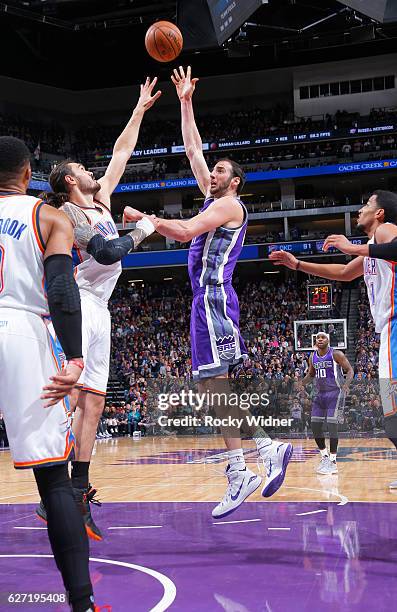 Kosta Koufos of the Sacramento Kings shoots against Steven Adams of the Oklahoma City Thunder on November 23, 2016 at Golden 1 Center in Sacramento,...