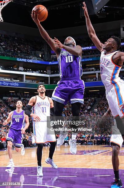 Ty Lawson of the Sacramento Kings shoots a layup against Jerami Grant of the Oklahoma City Thunder on November 23, 2016 at Golden 1 Center in...