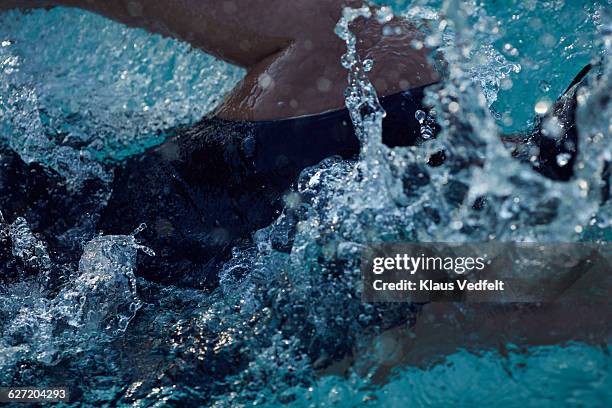 close-up of female swimmer getting up from pool - swimmer athlete stock pictures, royalty-free photos & images