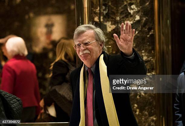 John Bolton, former United States Ambassador to the United Nations, waves as he leaves Trump Tower, December 2, 2016 in New York City....