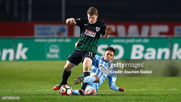 Tobias Ruehle of Muenster challenges Jamil Dem of Chemnitz during the Third League match between Preussen Muenster and Chemnitzer FC at...