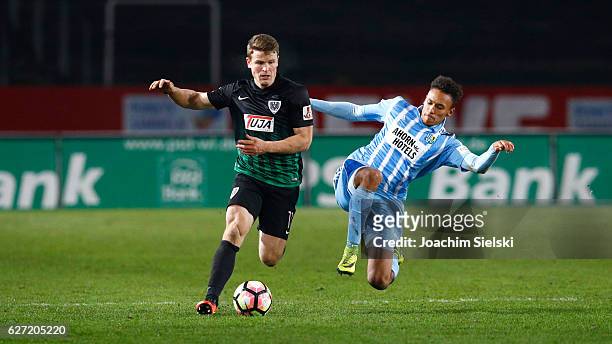 Tobias Ruehle of Muenster challenges Jamil Dem of Chemnitz during the Third League match between Preussen Muenster and Chemnitzer FC at...