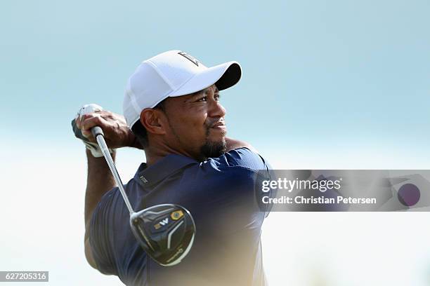 Tiger Woods of the United States hits his tee shot on the 13th hole during round two of the Hero World Challenge at Albany, The Bahamas on December...