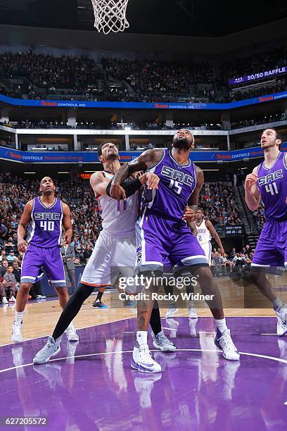 DeMarcus Cousins of the Sacramento Kings boxes out Enes Kanter of the Oklahoma City Thunder on November 23, 2016 at Golden 1 Center in Sacramento,...