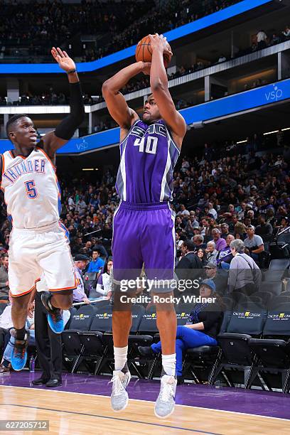 Arron Afflalo of the Sacramento Kings shoots against Victor Oladipo of the Oklahoma City Thunder on November 23, 2016 at Golden 1 Center in...