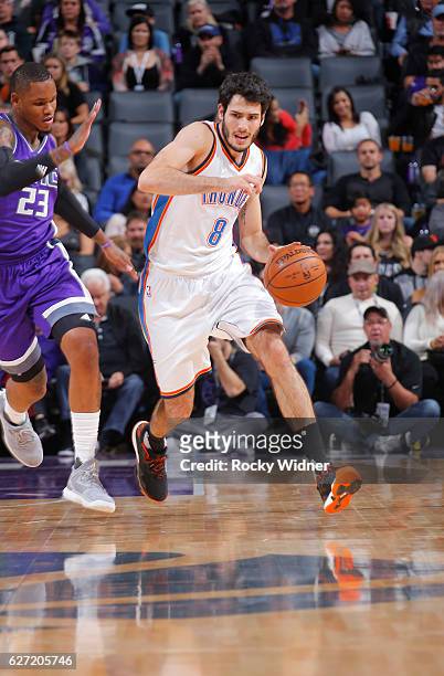 Alex Abrines of the Oklahoma City Thunder brings the ball up the court against Ben McLemore of the Sacramento Kings on November 23, 2016 at Golden 1...