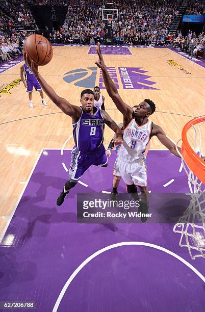 Rudy Gay of the Sacramento Kings shoots a layup against Jerami Grant of the Oklahoma City Thunder on November 23, 2016 at Golden 1 Center in...