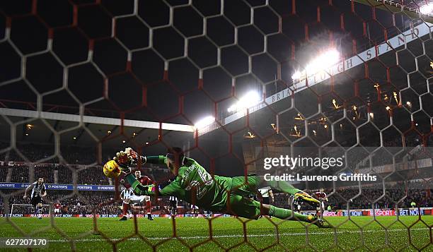 Karl Darlow of Newcastle Unitedd saves a penalty from Nicklas Bendtner of Nottingham Forest during the Sky Bet Championship match between Nottingham...