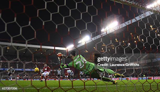 Karl Darlow of Newcastle Unitedd saves a penalty from Nicklas Bendtner of Nottingham Forest during the Sky Bet Championship match between Nottingham...