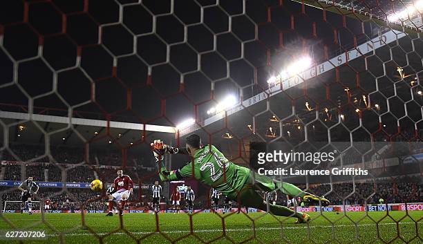 Karl Darlow of Newcastle Unitedd saves a penalty from Nicklas Bendtner of Nottingham Forest during the Sky Bet Championship match between Nottingham...