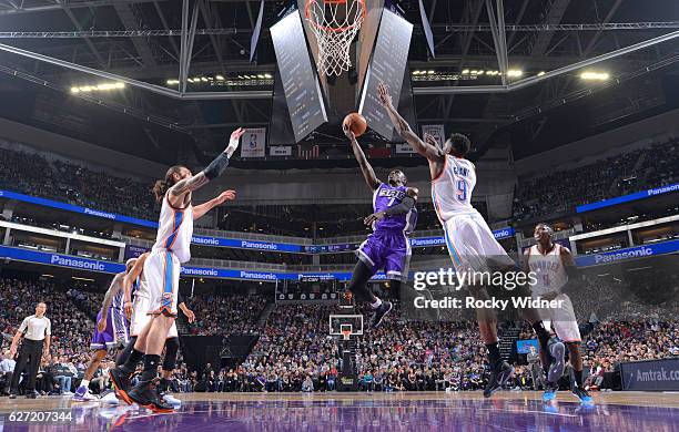 Darren Collison of the Sacramento Kings shoots a layup against Jerami Grant of the Oklahoma City Thunder on November 23, 2016 at Golden 1 Center in...