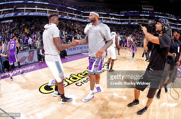 DeMarcus Cousins of the Sacramento Kings shakes hands with Anthony Morrow of the Oklahoma City Thunder on November 23, 2016 at Golden 1 Center in...