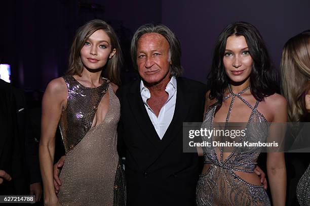 Gigi Hadid, Mohamed Hadid and Bella Hadid attend the Victoria's Secret After Party at the Grand Palais on November 30, 2016 in Paris, France.