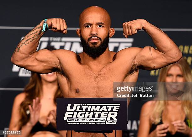 Flyweight champion Demetrious Johnson steps onto the scale during the TUF Finale weigh-in in the Palms Resort & Casino on December 2, 2016 in Las...