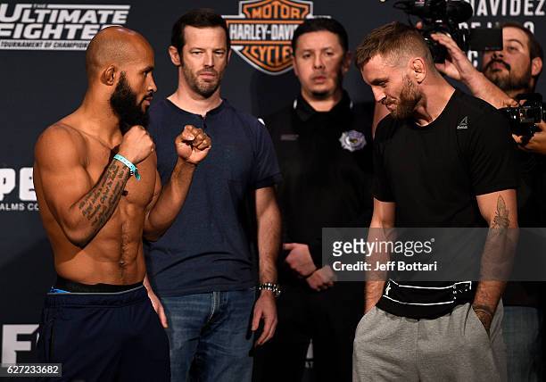Flyweight champion Demetrious Johnson and Tim Elliott face off during the TUF Finale weigh-in in the Palms Resort & Casino on December 2, 2016 in Las...