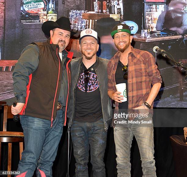 Daryle Singletary poses with Chris Lucas and Preston Brust of country music duo LoCash during the "Keepin' it Country with Daryle Singletary" show...