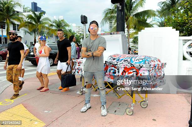 Artist Louis Carreon unveils his urban installation "Street Art Is Dead" on December 2, 2016 in Miami Beach, Florida.