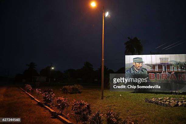Billboard with the image of former Cuban President Fidel Castro stands at the crossroads near his birthplace December 2, 2016 in Biran, Cuba. The...