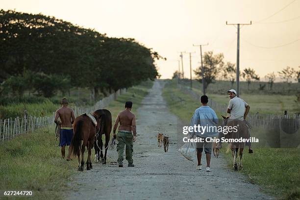Worker head home at the end of the day in the hometown and birthplace of former Cuban President Fidel Castro December 2, 2016 in Biran, Cuba. The...