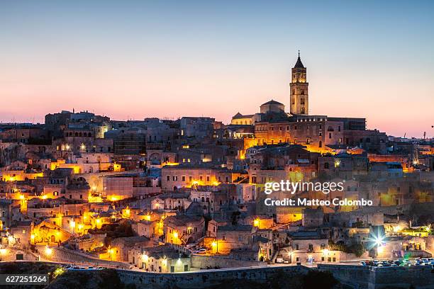 sassi di matera at dusk, matera, basilicata, italy - matera stock pictures, royalty-free photos & images