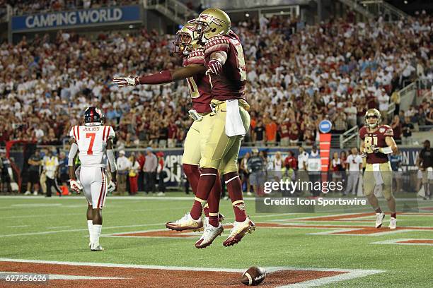 Florida State Seminoles wide receiver Travis Rudolph celebrates with Florida State Seminoles wide receiver Nyqwan Murray after scoring a touchdown in...