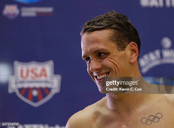 Tom Shields reacts after winning the Men's 100 Yard Butterfly Finals during day three of the 2016 AT&T Winter National Championships at McAuley...