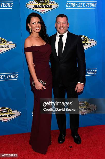 Sprint Cup Series driver Tony Stewart and his girlfriend Pennelope Jimenez attend the 2016 NASCAR Sprint Cup Series Awards at Wynn Las Vegas on...