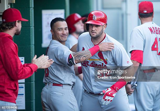 St. Louis Cardinals first baseman Matt Adams is hugged by second baseman Kolten Wong after hitting a two run home run in the fifth inning during the...