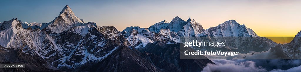Alpenglow on dramatic mountain peaks panorama Ama Dablam Himalayas Nepal